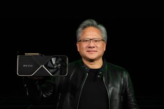 a photo of Jensen Huang holding an Nvidia GeForce RTX 4090