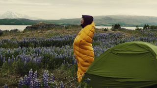 sleeping bag temperature ratings: woman in sleeping bag