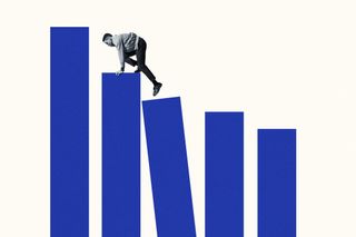 Full length side view of young man climbing up on blue bar graphs against white background