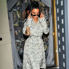 Kim Kardashian covered in money