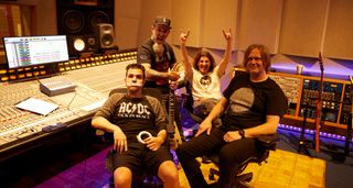 Charlie Benante, Scott Ian and Frank Bello of Anthrax in the studio control room with producer Jay Ruston