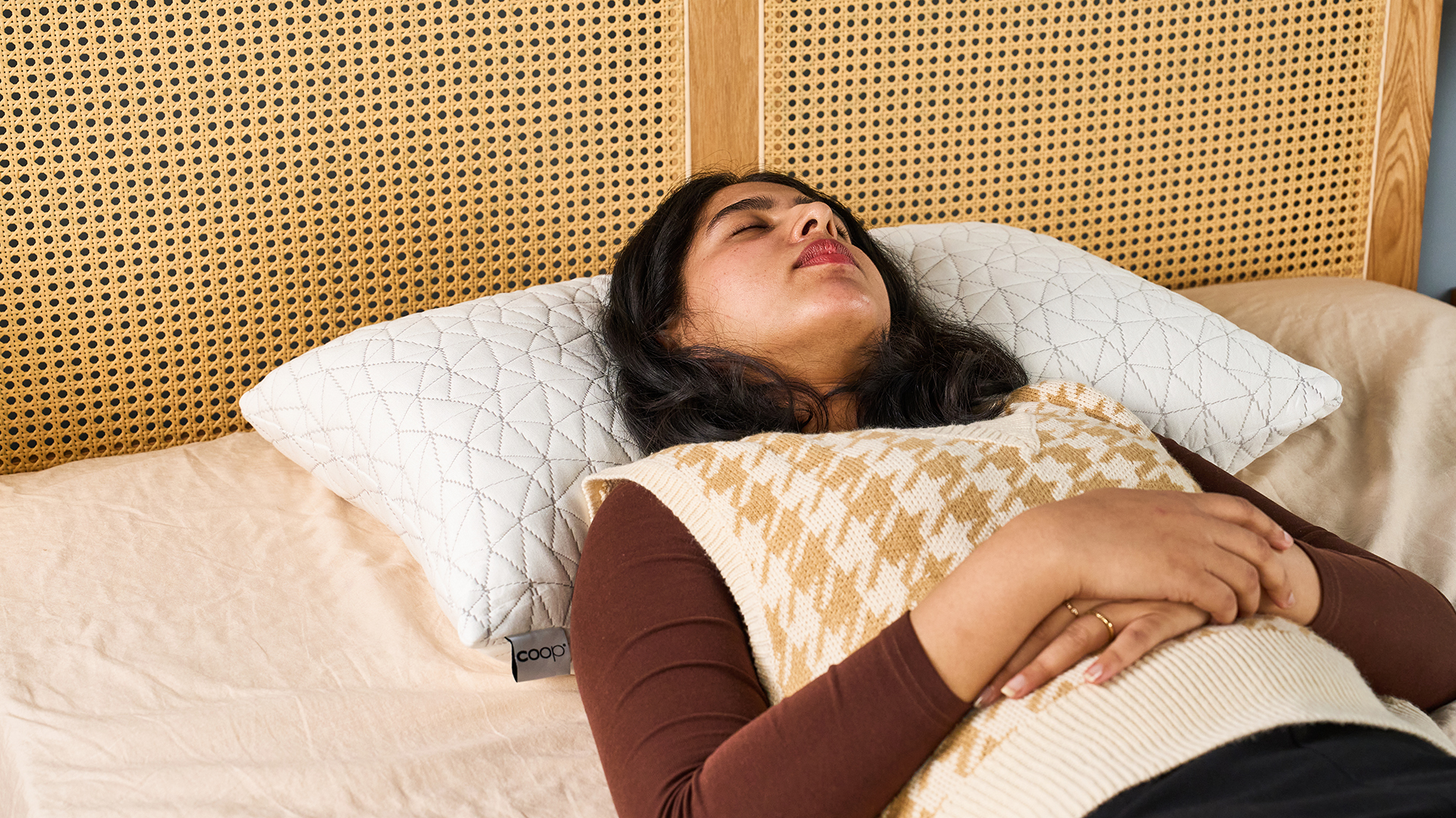 Tom's Guide Sleep Writer lying on her back on the Coop Original Adjustable Pillow
