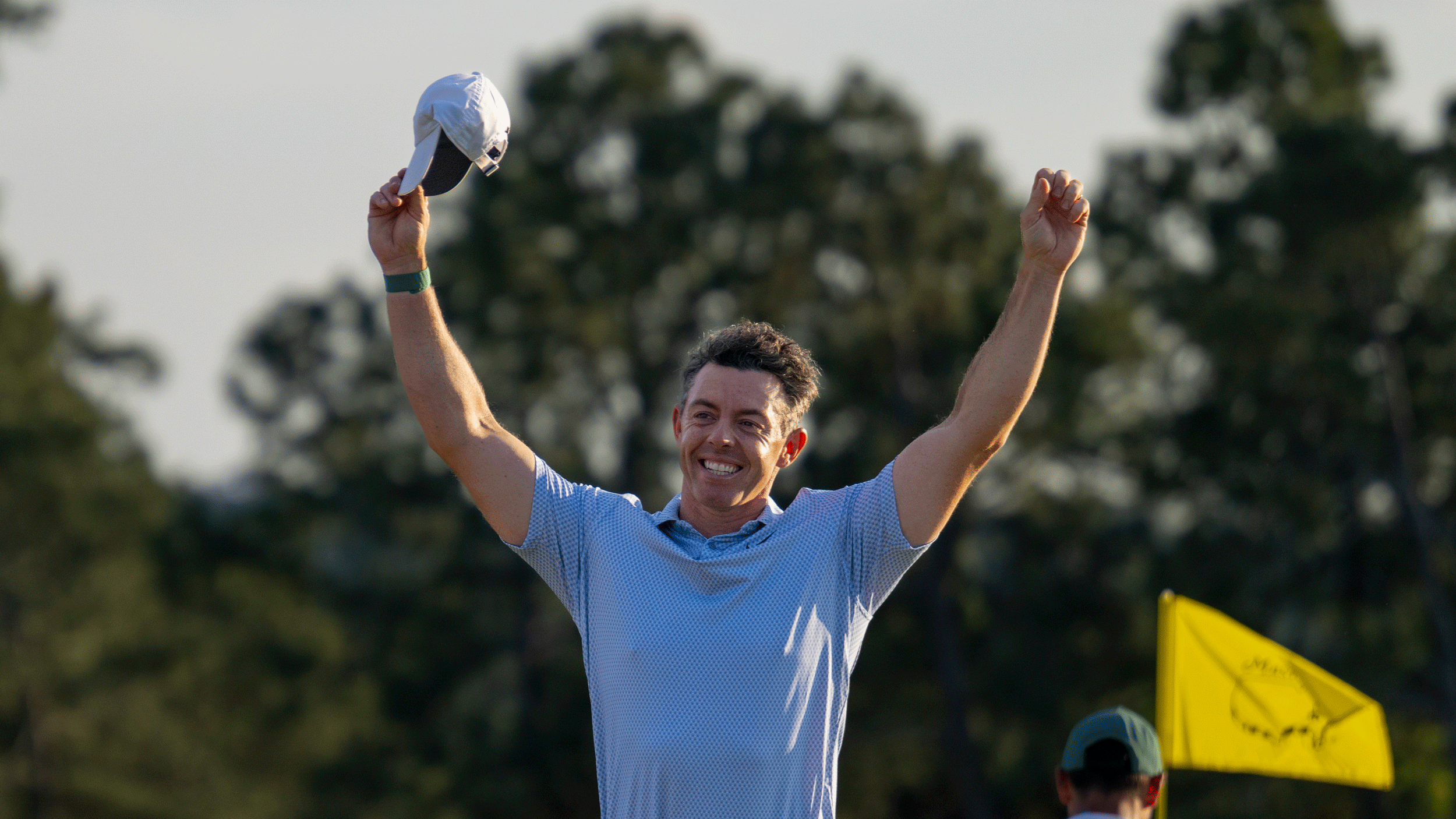 Rory McIlroy puts his hands up in the air after winning The Masters in 2026