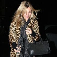 Kate moss wears the loewe amazon bag and a leopard jacket.