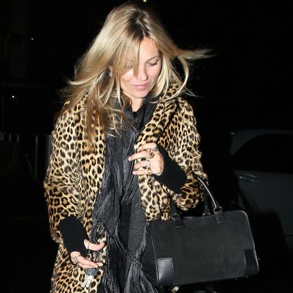Kate moss wears the loewe amazon bag and a leopard jacket.