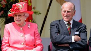 Queen Elizabeth II and Prince Philip, Duke of Edinburgh watch the Shropshire Diamond Jubilee Pageant in 2012