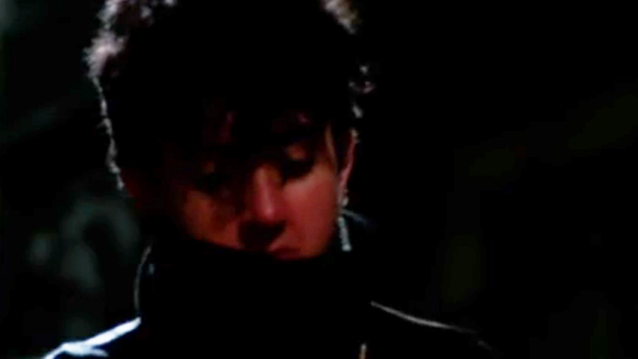 Patrick Dempsey with half his face covered by a turtle neck in The Stuff
