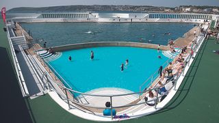 The sun shines above the Jubilee Pool lido in Penzance in Cornwall, England.