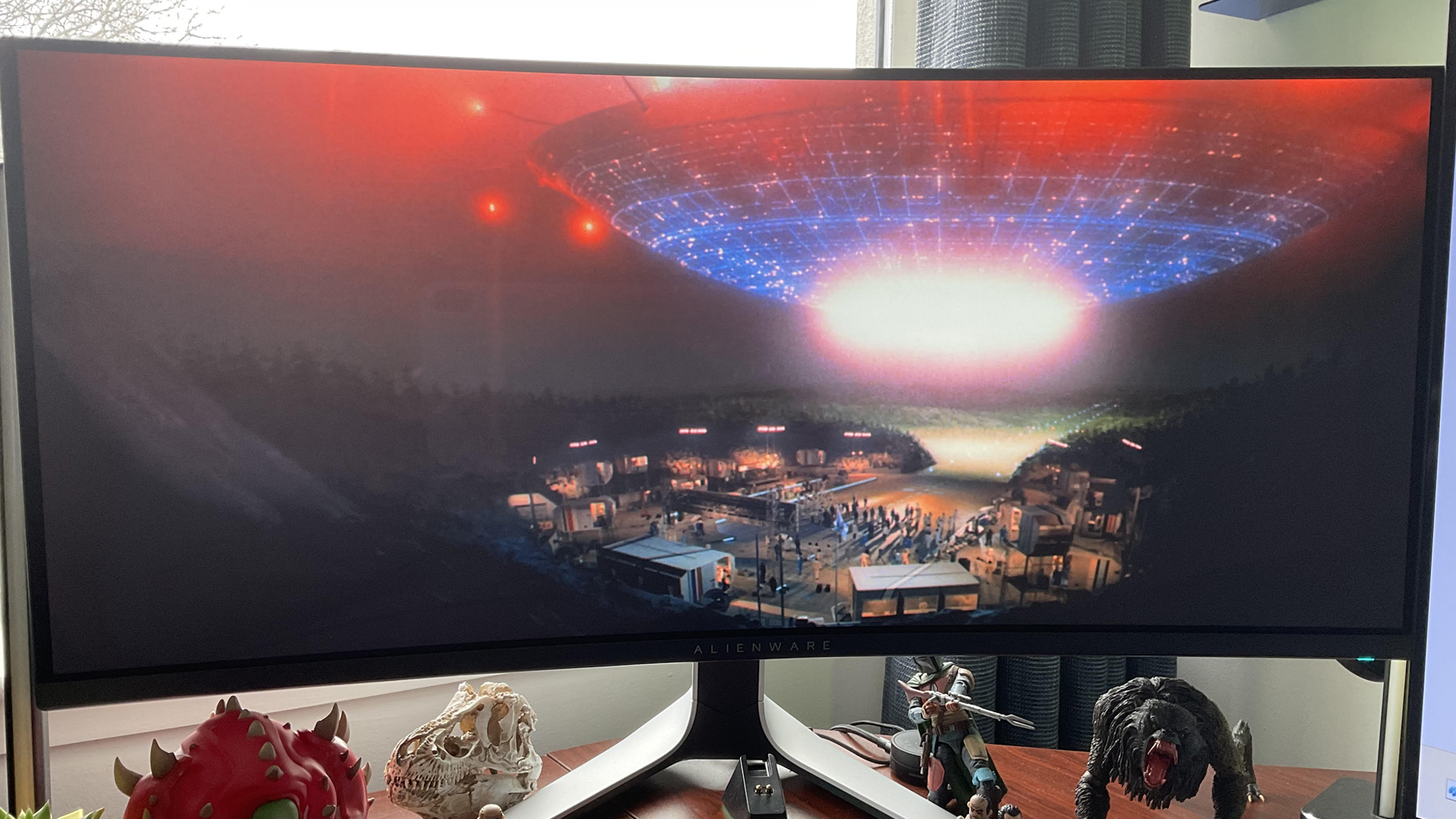 Alienware AW3423DW ultrawide monitor playing Close Encounters of the Third Kind, in a lounge