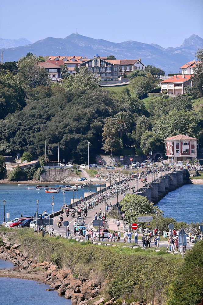 The peloton crosses a bridge during stage 15 of the Vuelta a Espana.