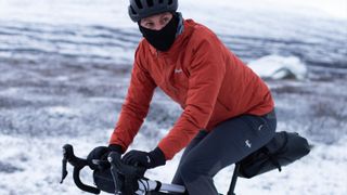 Rapha Explore jacket and pants being ridden in the snow
