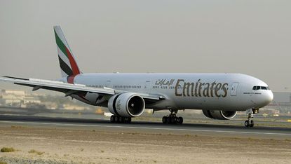 An Emirates plane readies for take-off at Dubai airport 