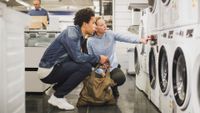 washing machine deals | picture of couple shopping for a washing machine