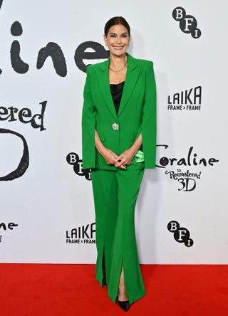 Teri Hatcher wearing a green suit