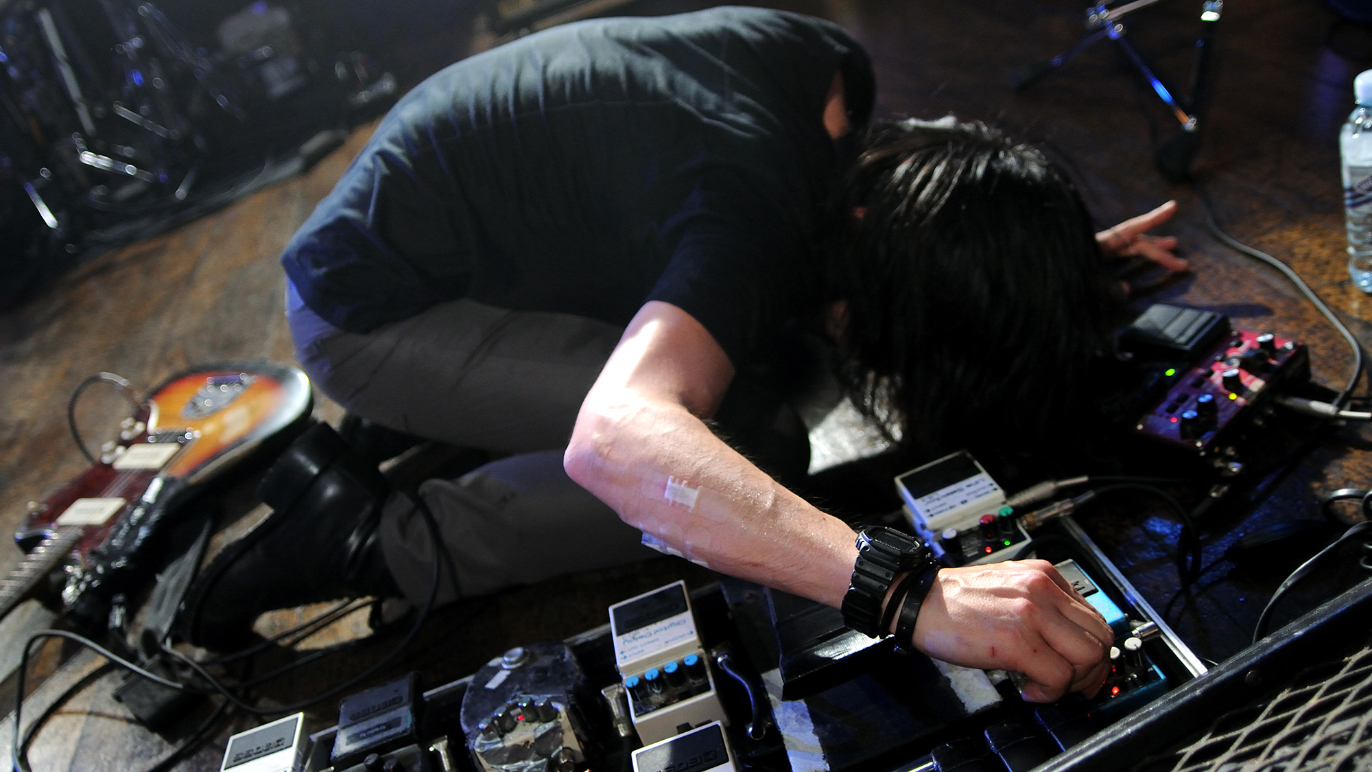 Takaakira "Taka" Goto of Mono performs on stage using guitar effects pedals at The Scala on March 26, 2009 in London.