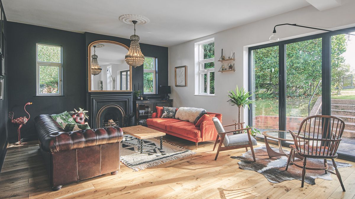 dark blue living room with extra seating near bifold doors