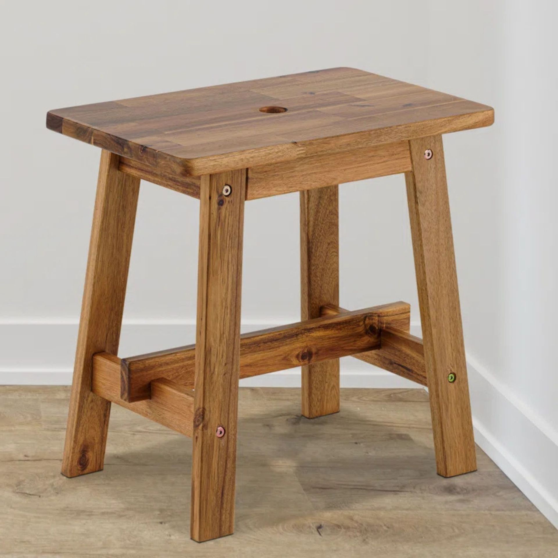 A wooden bathroom stool