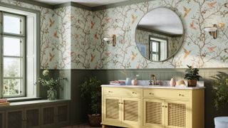 bathroom with green floral wallpaper and sage green painted woodwork