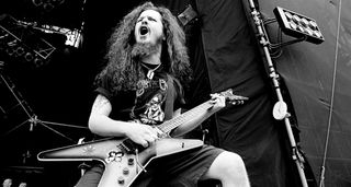 A black-and-white shot of Dimebag Darrell playing Monsters of Rock with his Dean ML