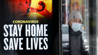 NHS poster saying Stay Home, Save Lives in London