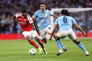 LONDON, ENGLAND - MARCH 22: Noni Madueke of Arsenal takes on Rodri of Manchester City and Nathan Ake of Manchester City during the Carabao Cup Final match Arsenal and between Manchester City at Wembley Stadium on March 22, 2026 in London, England. (Photo by Jacques Feeney/Offside/Offside via Getty Images)