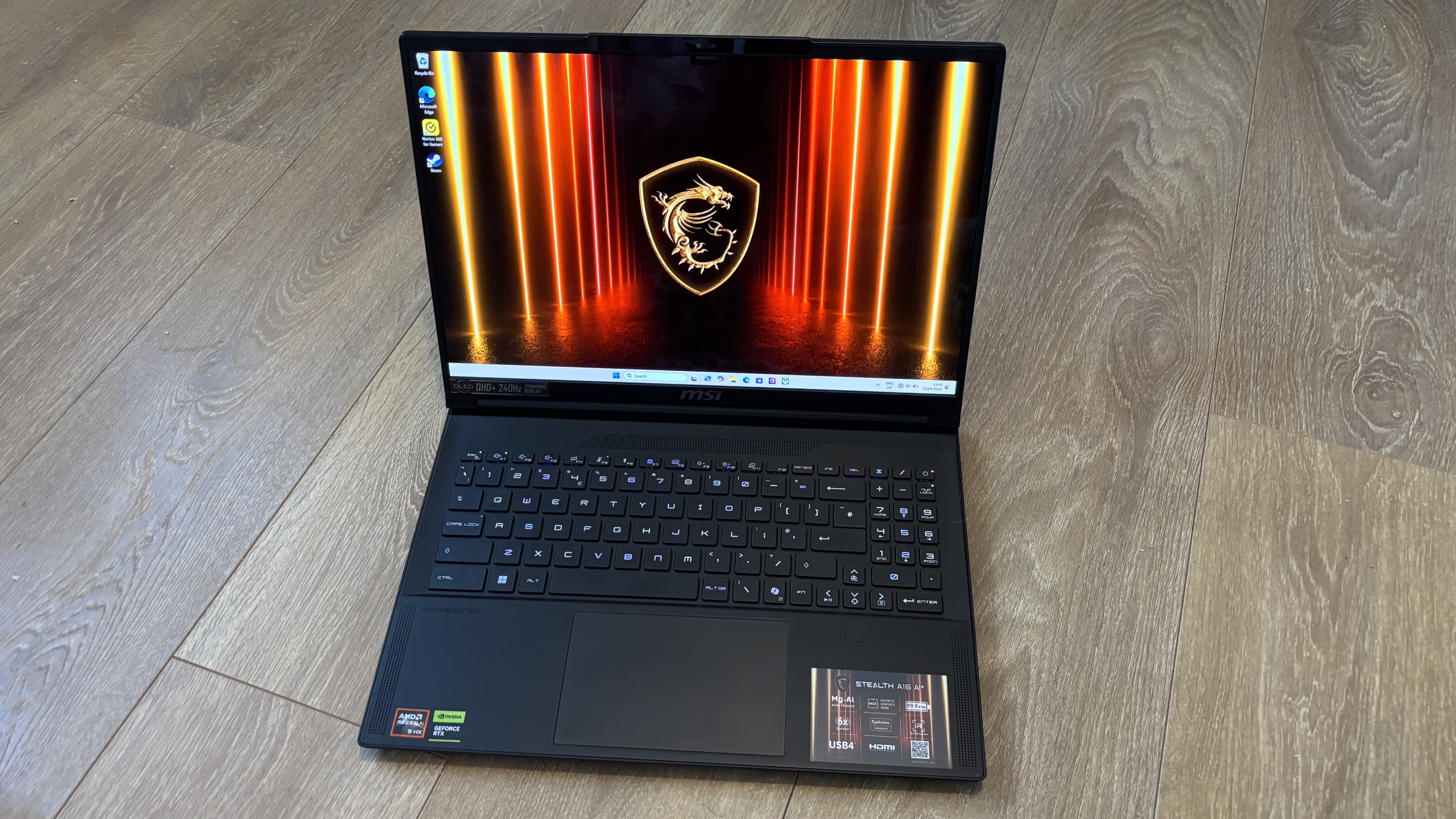 MSI Stealth A16 AI+ on wooden surface