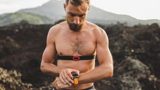 Man wearing heart rate chest strap monitor