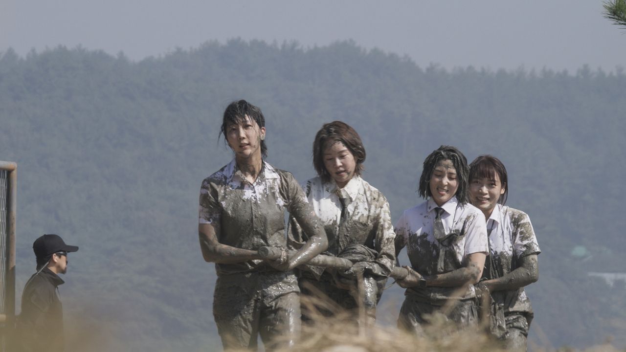 Some of the Siren: Survive the Island contestants covered in mud