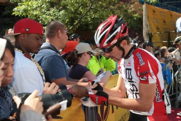 Andy Jacques-Maynes (Bissell) signs an autograph.