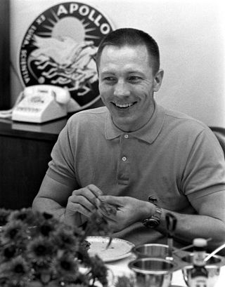 Apollo 13 astronaut Jack Swigert eats breakfast before launching on the mission, not yet realizing he's forgotten to file his taxes.