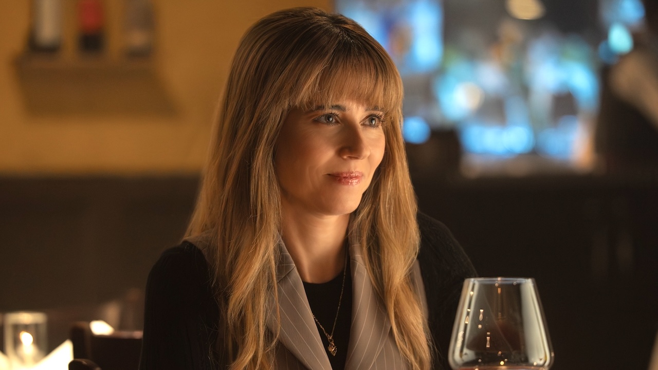 Carol smiling inside restaurant at dinner with Clark in DTF St. Louis Season 1 Episode 3