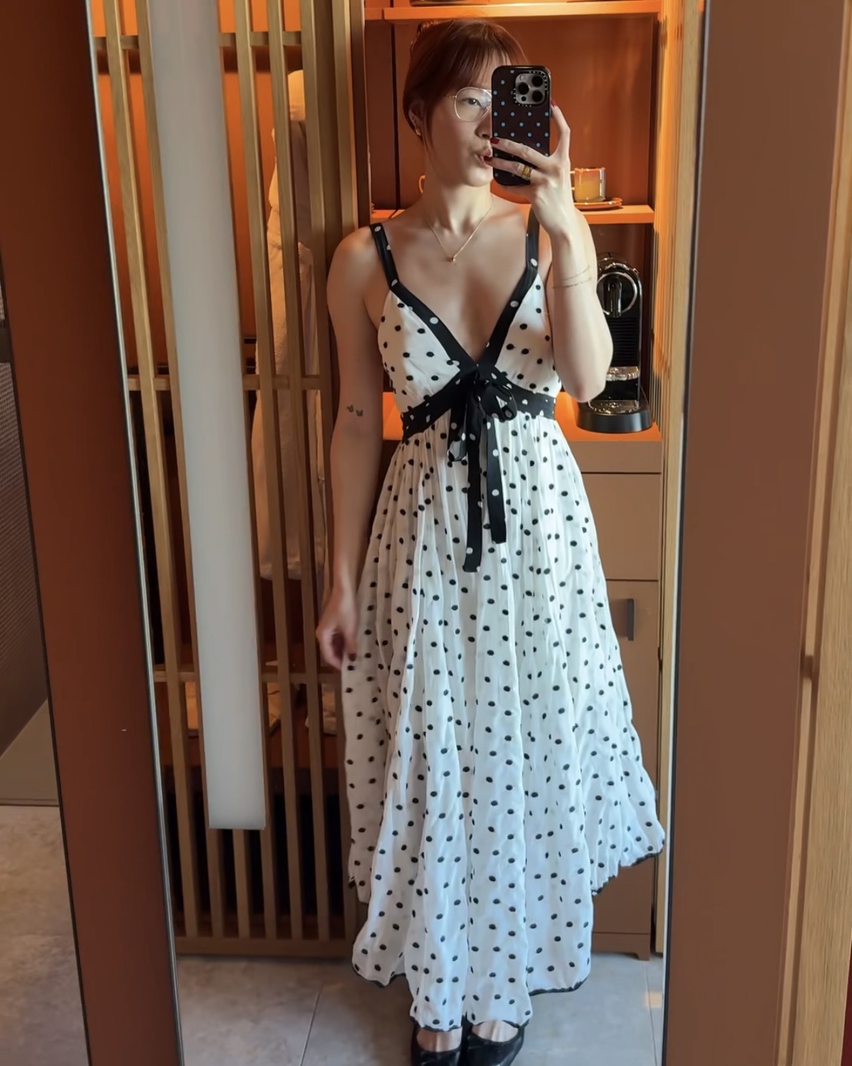 @kristinamichelleang wearing a polka dot dress in Paris.