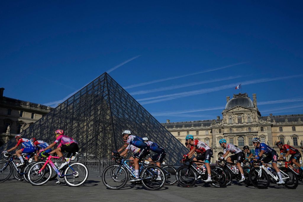 The pack of riders cycles past the Louvre Pyramid designed by Chinese architect Ieoh Ming Pei at the Louvre museum during the 21st and final stage of the 109th edition of the Tour de France cycling race 1156 km between La Defense Arena in Nanterre outside Paris and the ChampsElysees in Paris France on July 24 2022 RESTRICTED TO EDITORIAL USE MANDATORY MENTION OF THE ARTIST UPON PUBLICATION TO ILLUSTRATE THE EVENT AS SPECIFIED IN THE CAPTION Photo by Michel Euler POOL AFP RESTRICTED TO EDITORIAL USE MANDATORY MENTION OF THE ARTIST UPON PUBLICATION TO ILLUSTRATE THE EVENT AS SPECIFIED IN THE CAPTION RESTRICTED TO EDITORIAL USE MANDATORY MENTION OF THE ARTIST UPON PUBLICATION TO ILLUSTRATE THE EVENT AS SPECIFIED IN THE CAPTION Photo by MICHEL EULERPOOLAFP via Getty Images