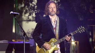 Rich Robinson playing a Gibson Les Paul Goldtop onstage in 2023
