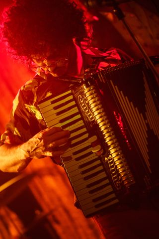 Daniel Radcliffe intensely plays the accordion in WEIRD: The Weird Al Yankovic Story.