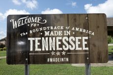 wooden sign that reads "Welcome to the soundtrack of America made in Tennessee" 