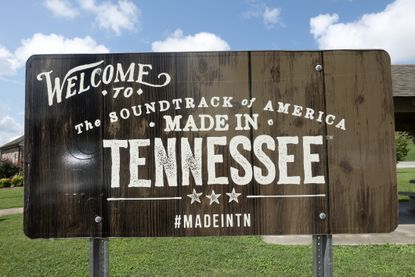 wooden sign that reads "Welcome to the soundtrack of America made in Tennessee"