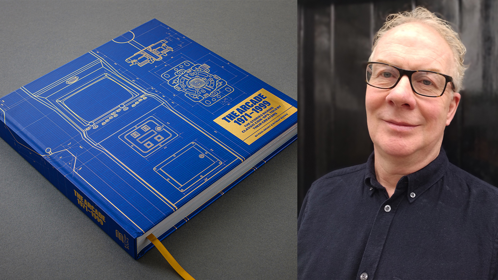 A blue book and a man in a blue short and glasses