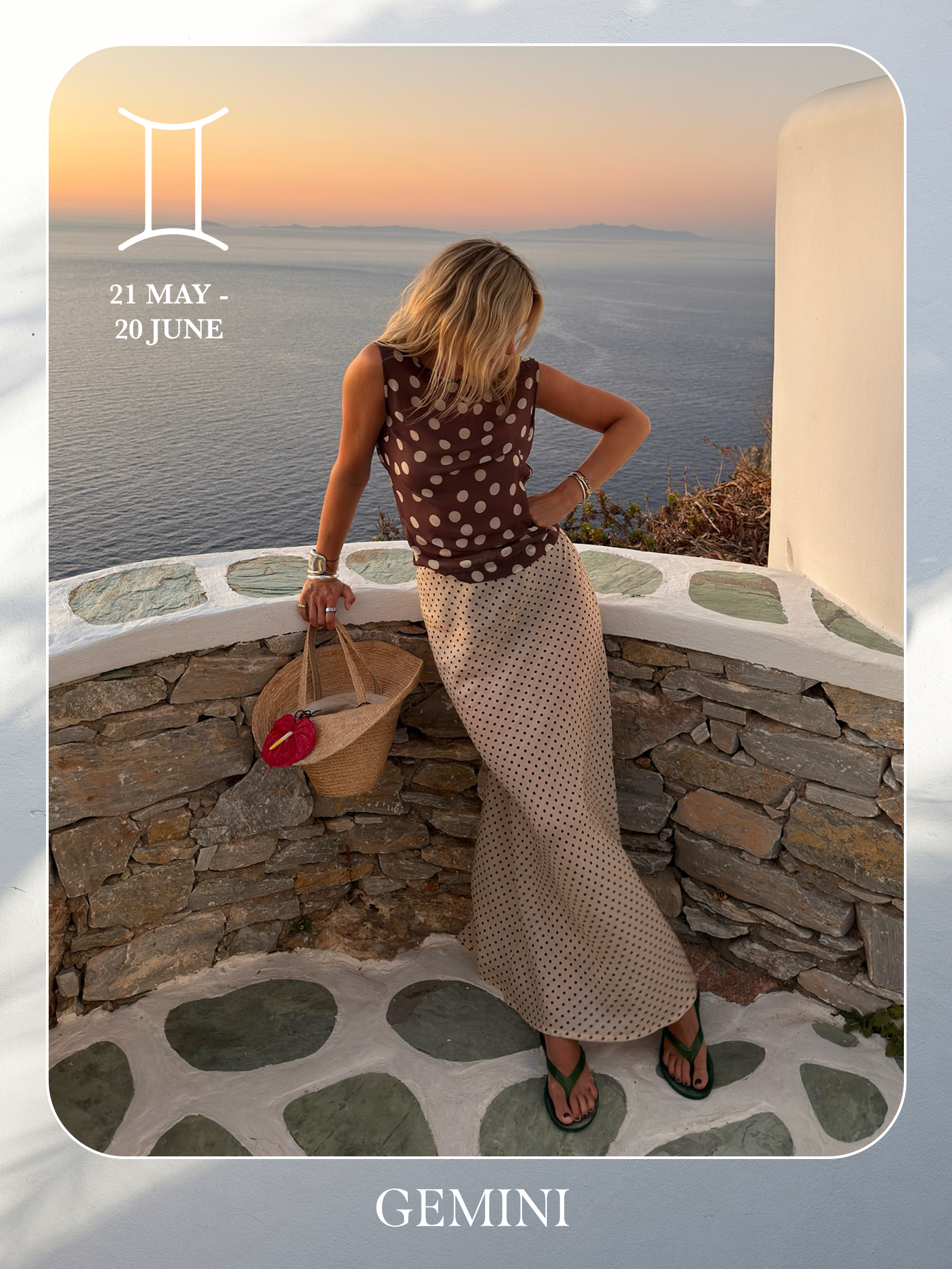 An image of @lucywilliams02 posing on a beach in a polka dot top and maxi skirt, showcasing the characteristics of sun sign dressing if you're a Gemini.