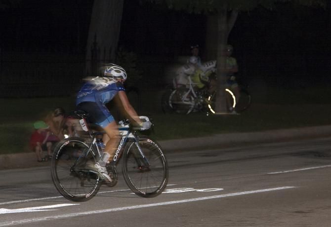 A lone breakaway rider struggles to keep a gap