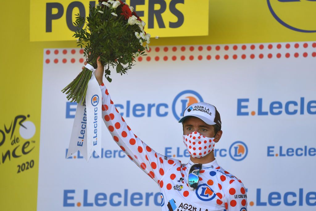 POITIERS FRANCE SEPTEMBER 09 Podium Benoit Cosnefroy of France and Team Ag2R La Mondiale Polka Dot Mountain Jersey Celebration Mask Trophy Flowers Covid safety measures during the 107th Tour de France 2020 Stage 11 a 1675km stage from ChatelaillonPlage to Poitiers TDF2020 LeTour on September 09 2020 in Poitiers France Photo by Stuart FranklinGetty Images