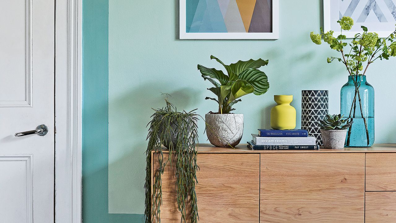 Blue wall with wooden side console