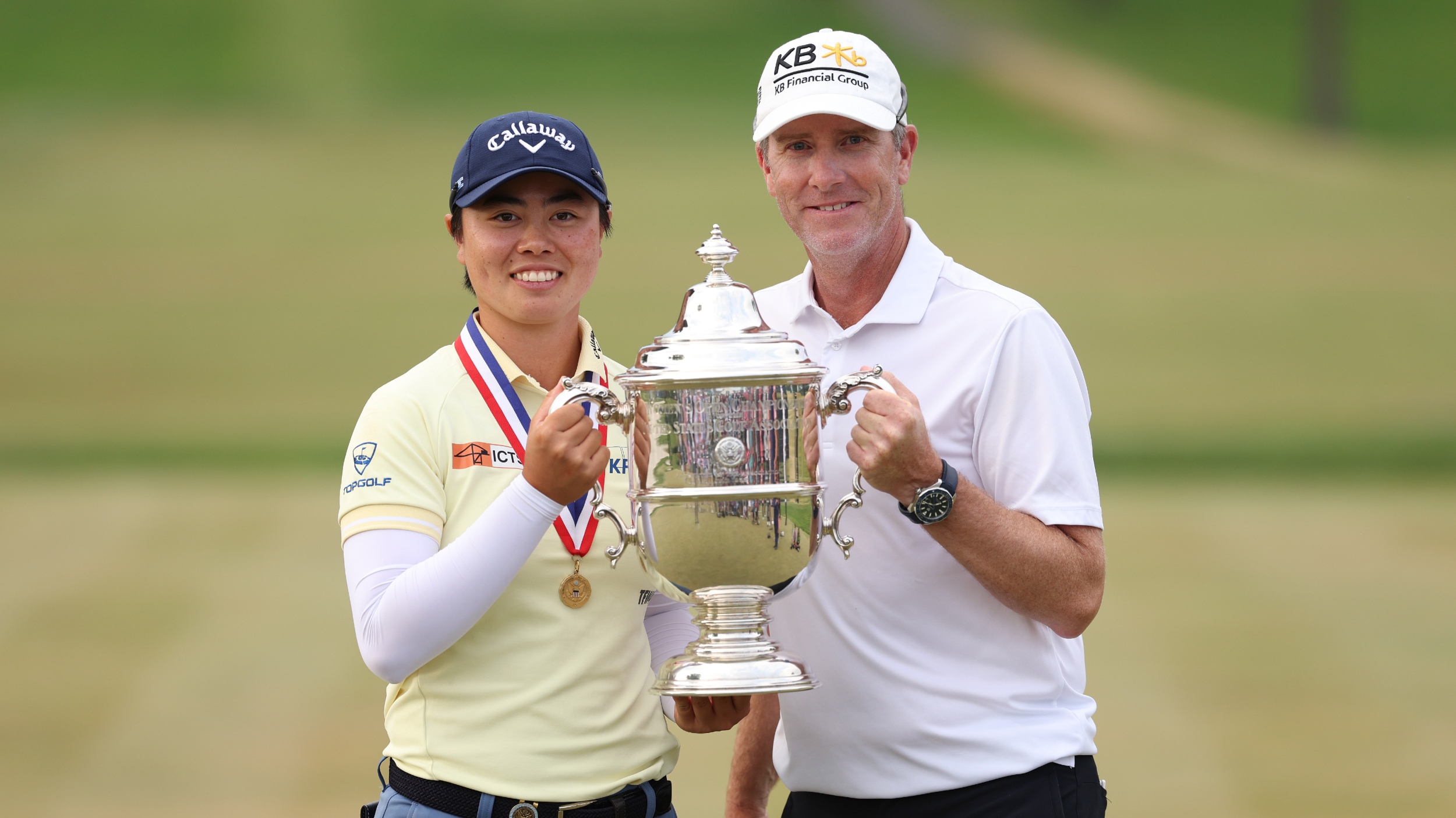 Yuka Saso and her caddie with the US Women&#039;s Open trophy 