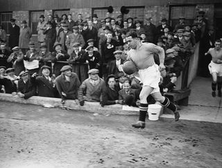 Dixie Dean, captain of Everton Football Club, leads his team onto the field for the Football Association Cup semi-final at Wolverhampton.