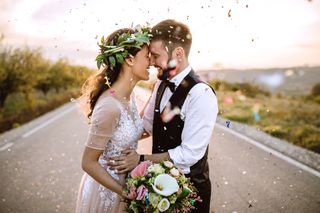 Wedding image showing bride and groom with confetti