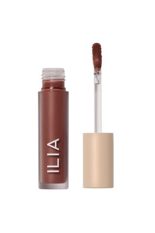 open ILIA Liquid Powder Eye Tint tube on a white background