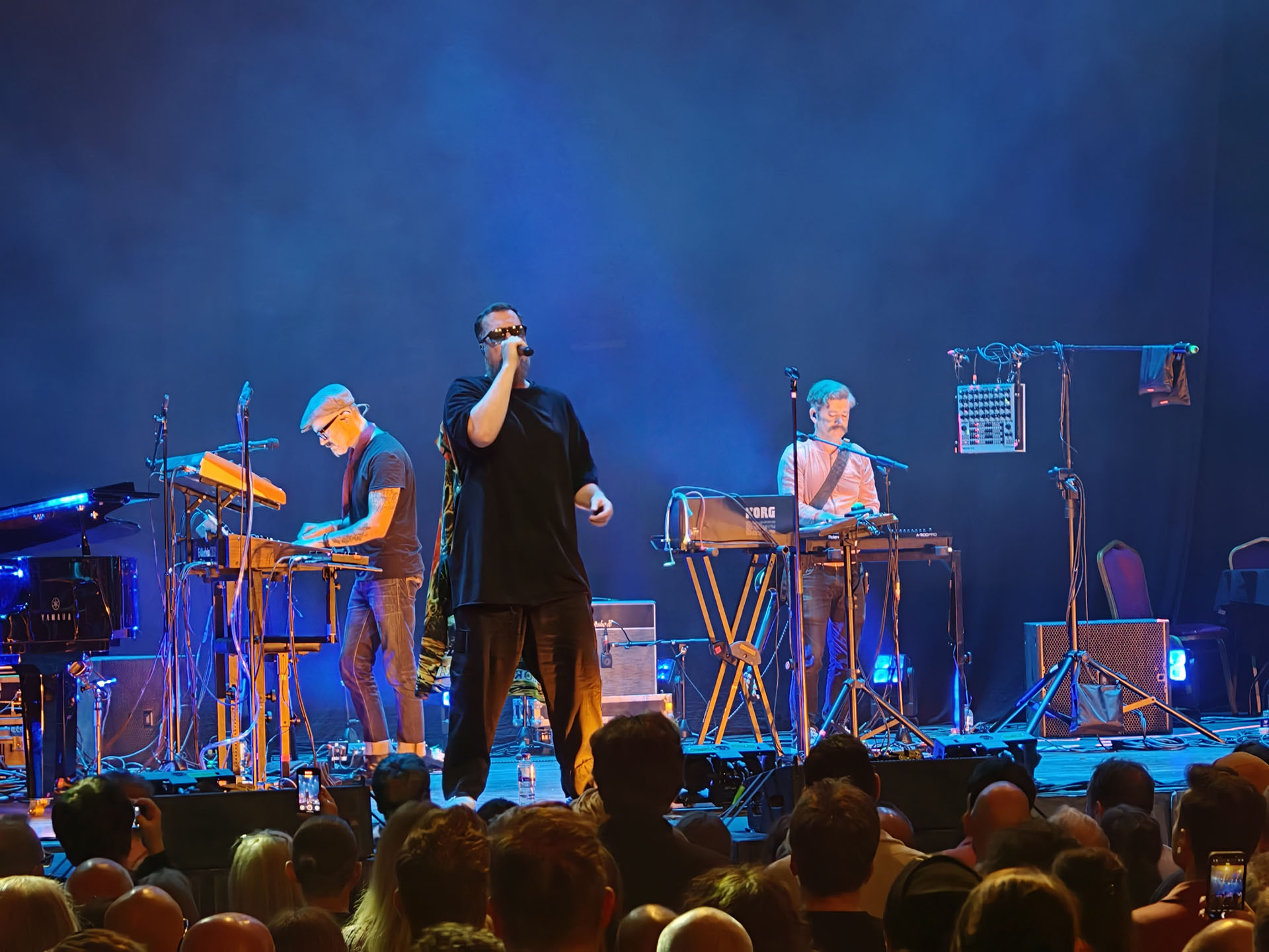 A photo of John Grant playing live.