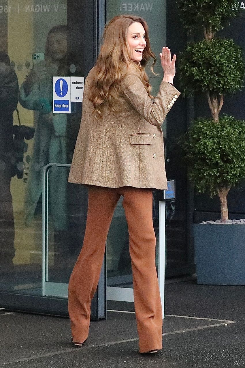 Kate Middleton wearing a tan blazer and cognac pants