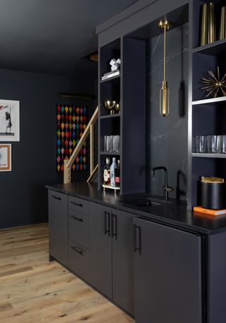 A large cabinet in black with several shelves