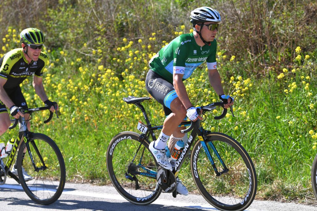 Alexey Lutsenko wears the green jersey